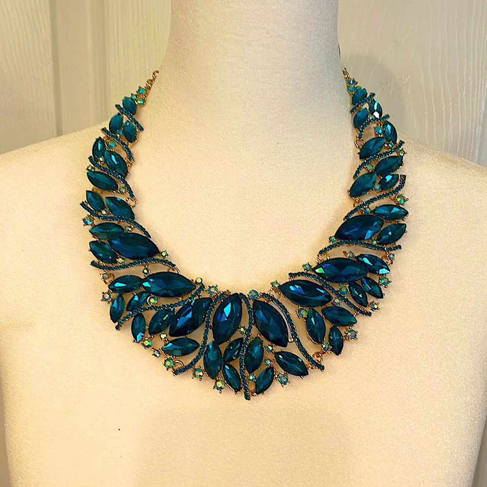 Beautiful blue rhinestone necklace with gold. Never worn....brand new.